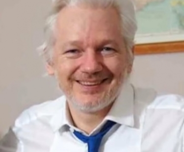 Biden justice department opts to continue with case against Assange